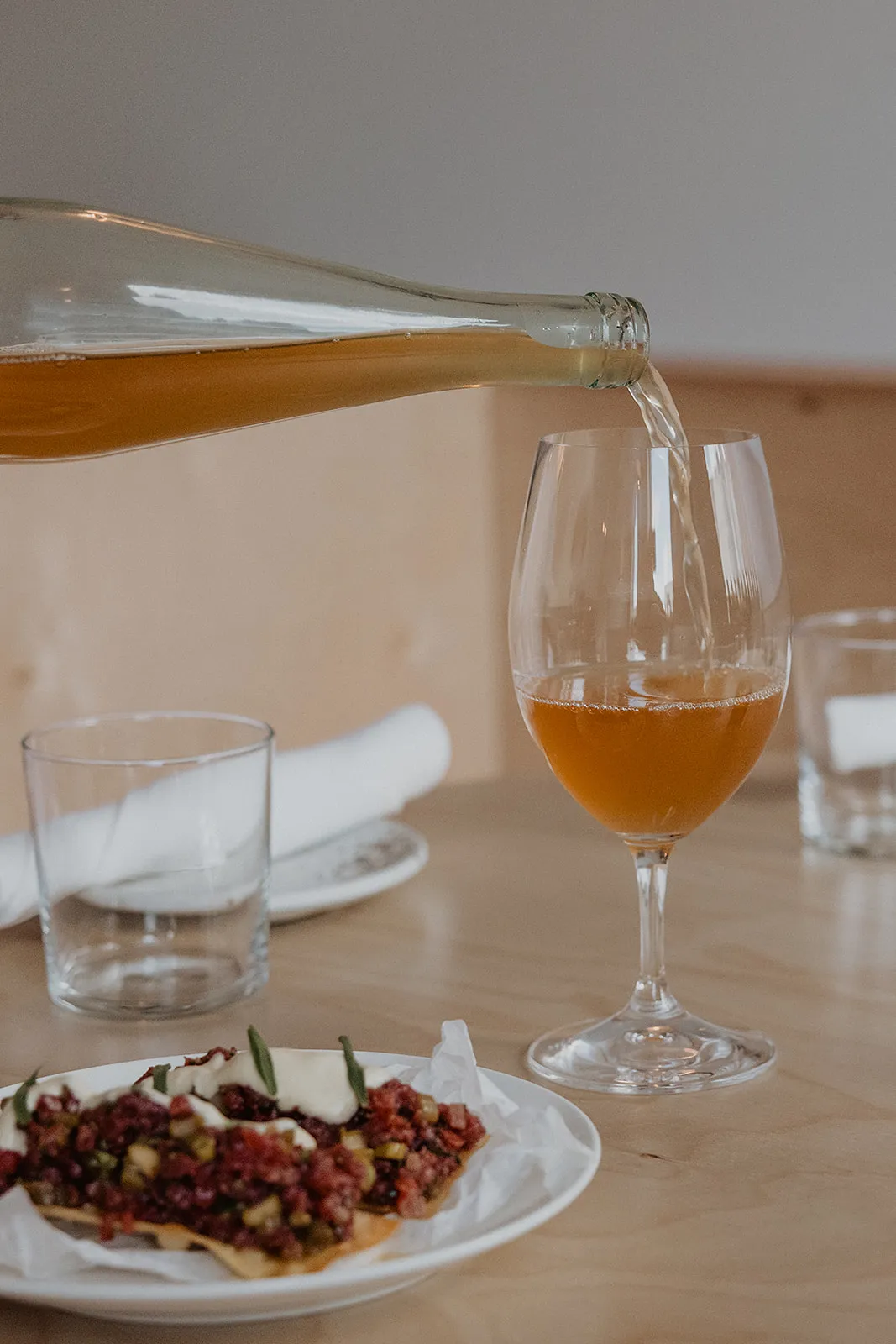 Wine glass and food at Wildling Restaurant