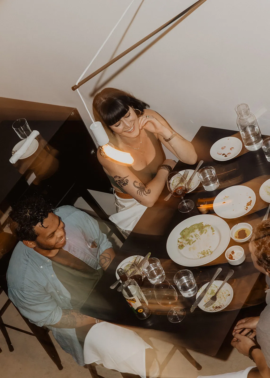 Shows the ambience of Wildling Restauran with a group dining together in a booth